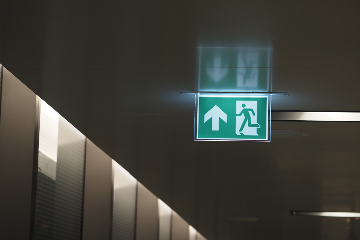 Illuminated emergency exit sign tested by DH Electrical in Liverpool